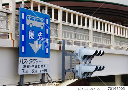 Traffic lights and road signs installed on the pedestrian bridge 70162903
