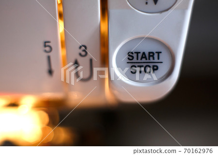 Close-up of a sewing machine button. workplace tailor. sewing industry 70162976