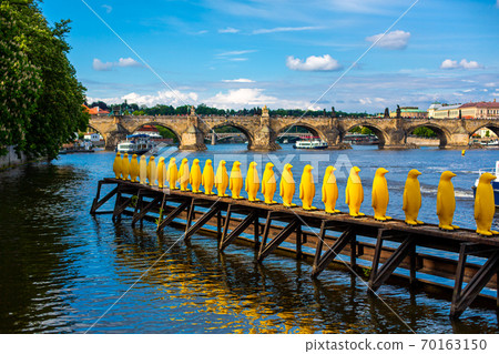 Art object march of yellow penguins. Weird art statues of Prague Art object march of yellow penguins. Weird art statues of Prague 70163150