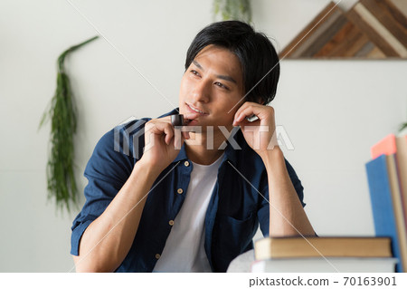 Cool man smoking a cigarette 70163901