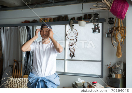 A cool man wearing a cap 70164048