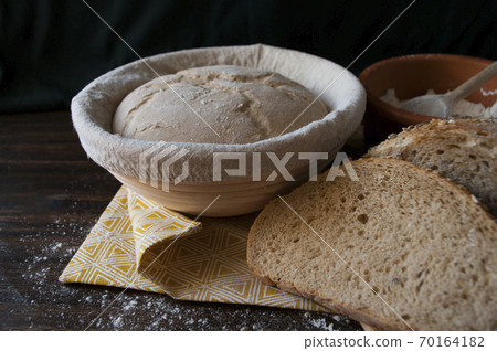 sourdough dough in proofing basket , whole wheat. Rye flour bread slices. Home baked bread. Close up. 70164182