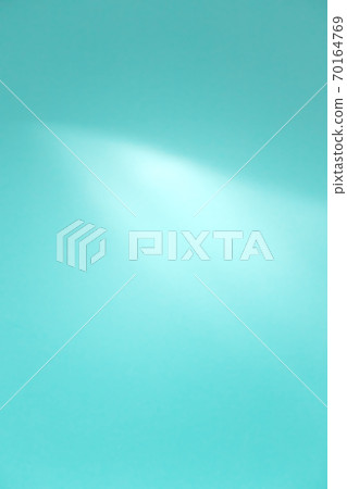 Blue abstract defocused background with bright light emphasis, vertical 70164769