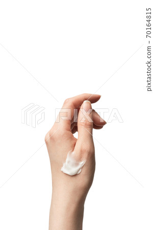 Female hand applies moisturizer cream smear isolated on white background. Caucasian ethnicity hand and delicate lotion 70164815