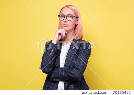 Portrait of a young attractive business woman with glasses Portrait of a young attractive business woman with glasses 70165431