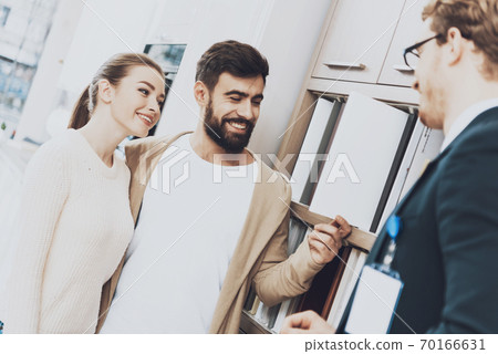 A man with a beard looks at kitchen material. A man with a beard looks at kitchen material. 70166631