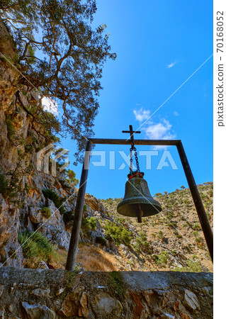 Church bell of lost Orthodox church of St John the Hermit in hills, Akrotiri, Crete, Greece. Upshot at daytime in spring. Remote christian monastery 70168052