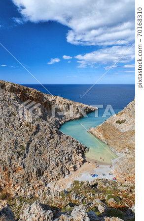 Vertical view of z-shaped bay, typical Greek sunny landscape. Great blue sky, beautiful clouds. Seitan Limania, Akrotiri, Chania, Crete island, Greece Vertical view of z-shaped bay, typical Greek sunny landscape. Great blue sky, beautiful clouds. Seitan Limania, Akrotiri, Chania, Crete island, Greece 70168310