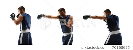 Young boxer against white studio background in motion of step-to-step kicking Young boxer against white studio background in motion of step-to-step kicking 70168635
