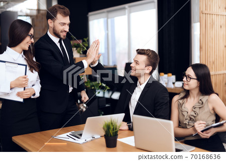 The head of company talks with other employees. The head of company talks with other employees. 70168636