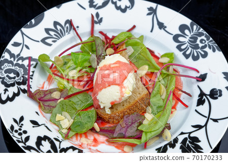 Bruschetta with goat cheese and beetroot mousse Bruschetta with goat cheese and beetroot mousse 70170233