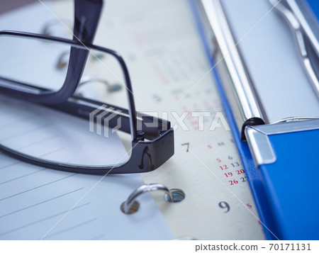 Business image, binder, calendar, notebook, glasses Business image, binder, calendar, notebook, glasses 70171131