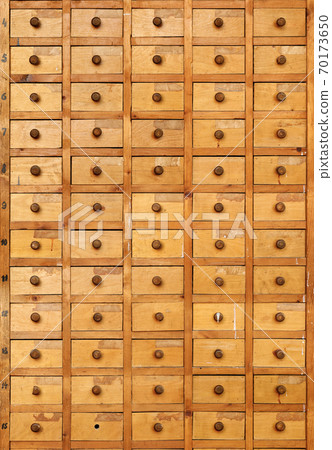 Old wooden cabinet with drawers Old wooden cabinet with drawers 70173650