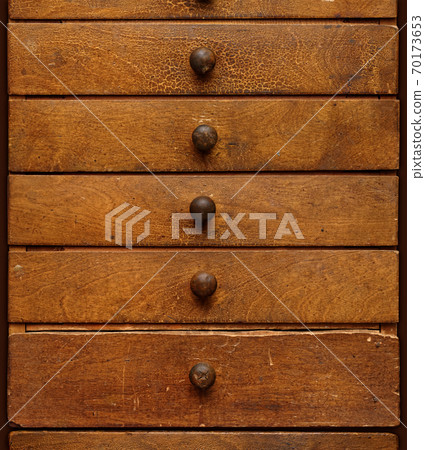 Old wooden cabinet with drawers Old wooden cabinet with drawers 70173653