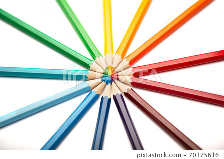 A lot of colorful wooden pencils on a white background A lot of colorful wooden pencils on a white background 70175616