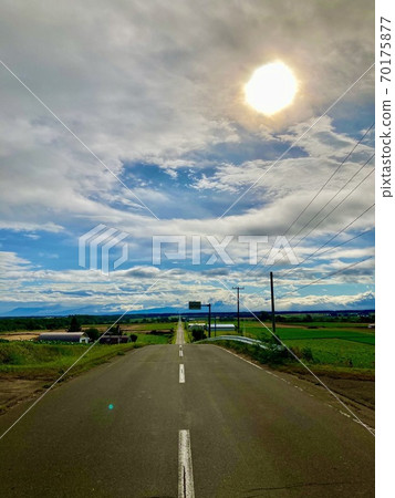 A straight road that continues forever in Koshimizu Town 70175877