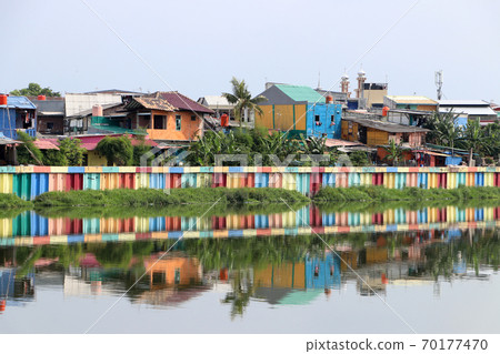 Rainbow village in Indonesia, colorful houses and colorful dam along the canal of slum. 70177470