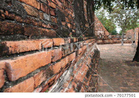 Perspective angle of brick wall and location in the ruins of ancient remains at Wat Worachet 70177501