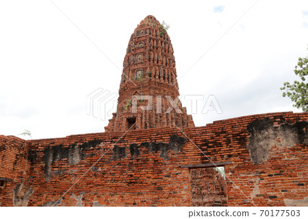 The Main Phra Prang or pagoda, the view from the church in the ruins of ancient remains 70177503