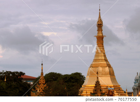 Golden octagon of Sula pagoda located in the heart of downtown 70177550