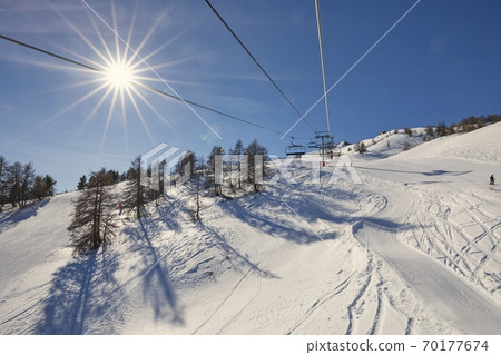 Ski lift at a ski resort 70177674