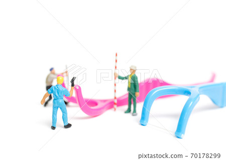 Miniature people : The team work on Dental floss isolate on white background 70178299