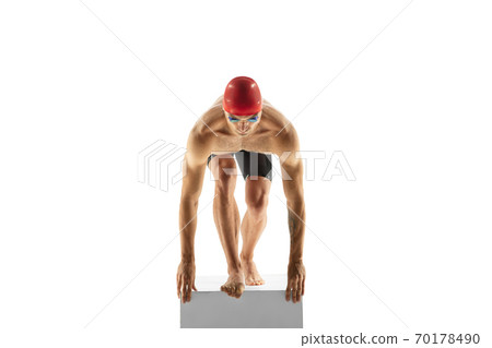 Caucasian professional sportsman, swimmer training isolated on white studio background Caucasian professional sportsman, swimmer training isolated on white studio background 70178490