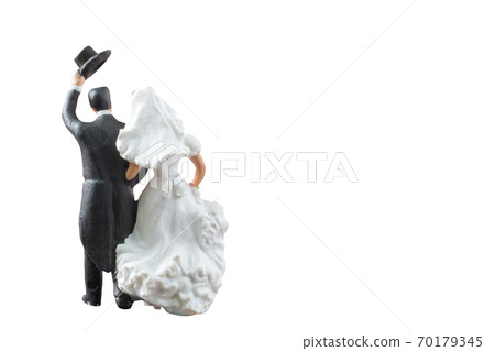 Miniature people wedding , bride and groom couple isolated on white background with clipping path Miniature people wedding , bride and groom couple isolated on white background with clipping path 70179345