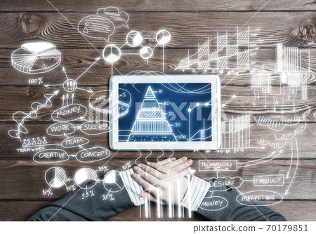 Concept of business strategy and planning with tablet on wooden table Concept of business strategy and planning with tablet on wooden table 70179851