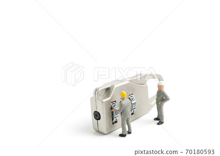 Miniature people worker  : Teamwork helps to unlock password on the keys.  70180593