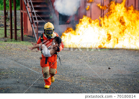 The firefighter was helping the girl. Leave the burning and smoky building. 70180814
