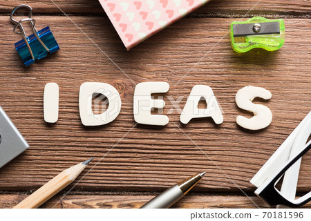 Idea word on wooden table and office stationary around 70181596