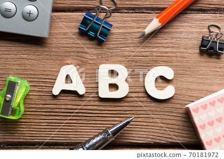 ABC word on wooden table and office stationary around 70181972