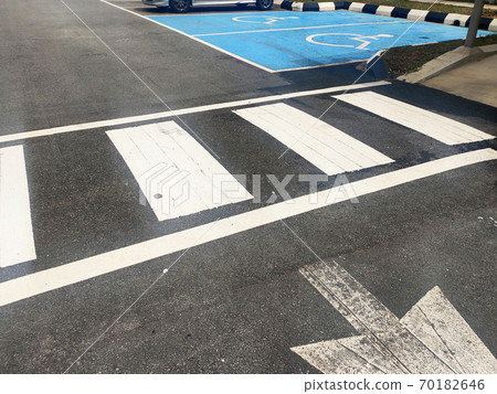 Zebra crossing for pedestrians on the road. Made of thermoplastic material and has light-reflective particles. Provides safety advantages to pedestrians. 70182646