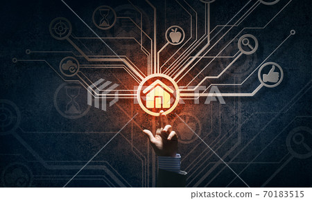 Close of businessman hand showing at user interface glowing on wall Close of businessman hand showing at user interface glowing on wall 70183515