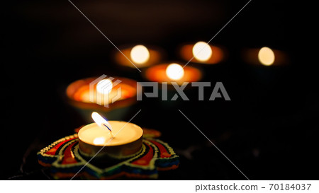 Happy Diwali day. Colorful traditional oil lamp diya on dark background. 70184037