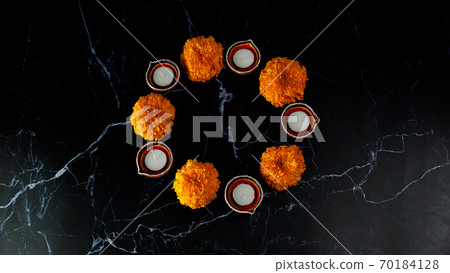 Happy Diwali day. Colorful traditional oil lamp diya on dark background. Happy Diwali day. Colorful traditional oil lamp diya on dark background. 70184128