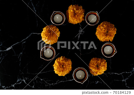 Happy Diwali day. Colorful traditional oil lamp diya on dark background. Happy Diwali day. Colorful traditional oil lamp diya on dark background. 70184129