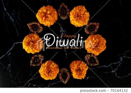 Happy Diwali day. Colorful traditional oil lamp diya on dark background. Happy Diwali day. Colorful traditional oil lamp diya on dark background. 70184132