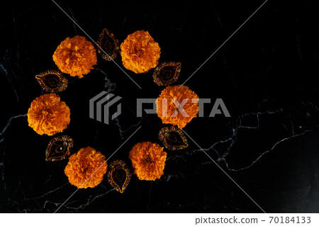 Happy Diwali day. Colorful traditional oil lamp diya on dark background. Happy Diwali day. Colorful traditional oil lamp diya on dark background. 70184133