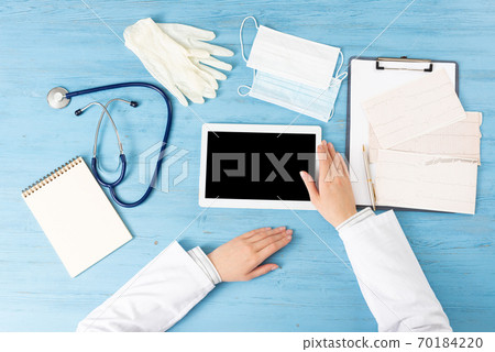 Top view of doctor hands with tablet computer 70184220