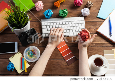 Close up woman hands with colorful paper balls Close up woman hands with colorful paper balls 70184700