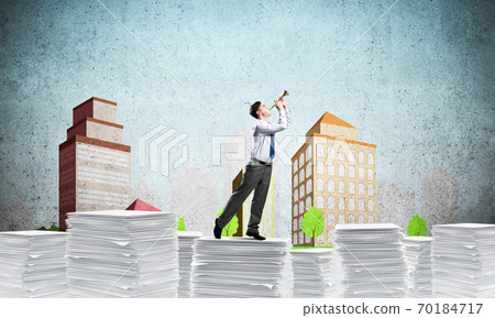 Happy businessman playing fife. 70184717