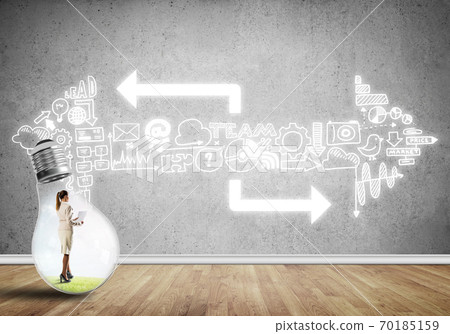 Businesswoman trapped in bulb Businesswoman trapped in bulb 70185159