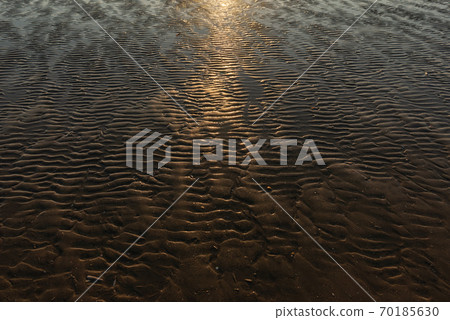 Beautiful sunset on the sand beach coast in Denmark. Sunny nature background. Clear sky with sun 70185630