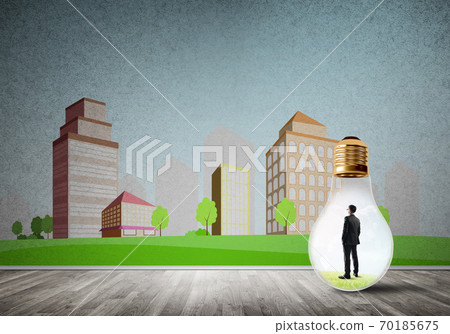 Businessman trapped in bulb Businessman trapped in bulb 70185675