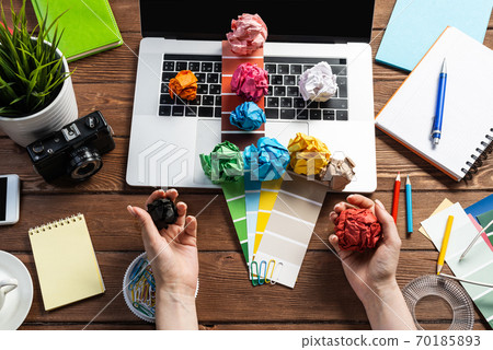 Close up woman hands with colorful paper balls Close up woman hands with colorful paper balls 70185893