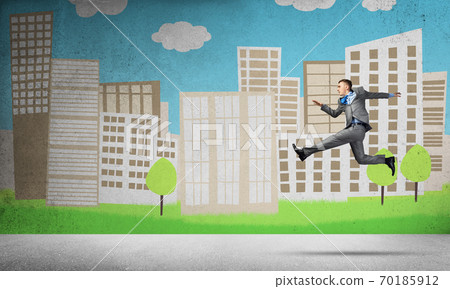 Businessman jumping high Businessman jumping high 70185912