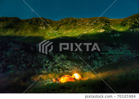 Two tents at night in mountains 70185984