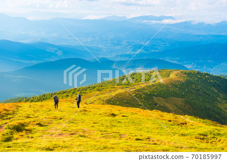 People travelling in mountains People travelling in mountains 70185997